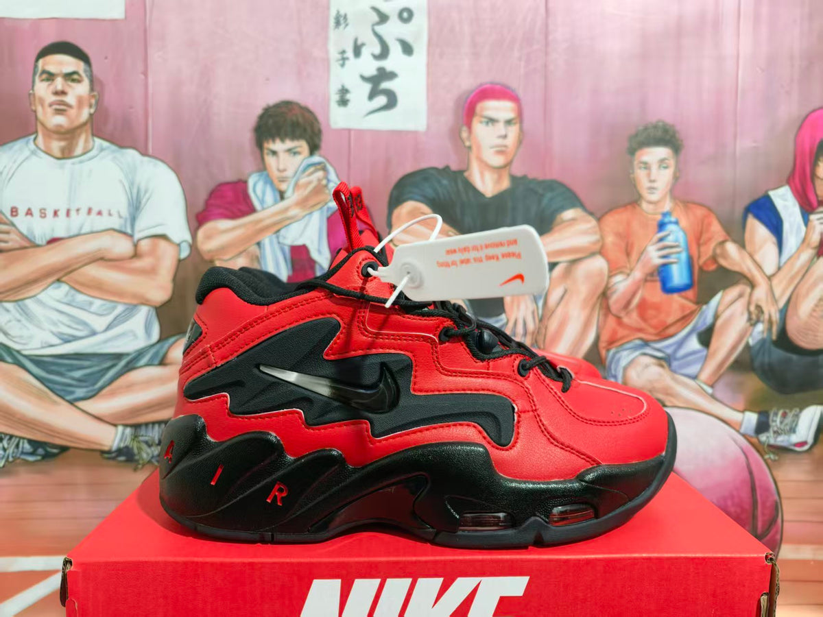 Side view of red and black Nike Air Flight sneakers displayed on a Nike shoebox.
