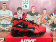 Side view of red and black Nike Air Flight sneakers displayed on a Nike shoebox.