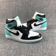 Side profile of the pair showing black Swoosh panels, white side panels, and mint green heel sections.