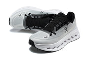 Pair of grey On Cloudmonster 3 shoes shown from above