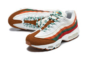 Pair of Nike Air Max 95 TT sneakers in a front three-quarter view, showing the layered colored panels and patterned laces.