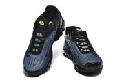 Front view of the black and blue sneakers with black laces and Paris lettering.