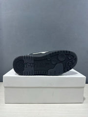 Close view of the black outsole showing its textured tread pattern and embossed branding.