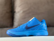 Opposite side view of the blue Kobe 6 shoe, showing the textured upper and dark Swoosh.