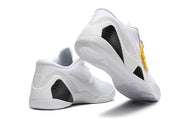 All-white shoes shown from the heel and outsole.