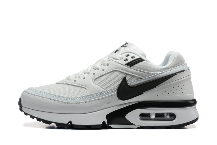 Side view of a white and black Nike low-top sneaker with a visible heel air unit