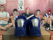 Rear view of blue sneakers with silver-tone heel panels and G-TEK tongue logos.
