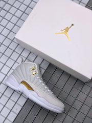 White high-top sneaker displayed beside a white Jordan shoebox with a gold logo.