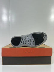 Underside view showing the grey and black patterned outsoles