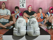 Rear view of white Nike basketball sneakers with GT heel details.