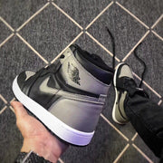 Close-up angled view highlighting the grey heel and ankle panels, black overlays and white midsole.