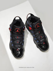 Top view showing the black lacing system, padded tongues, navy panels, and red Jordan details.