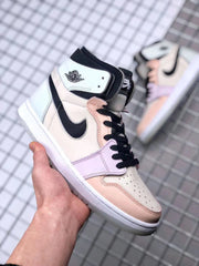 Angled front-side view of the sneaker showing the perforated toe, pastel overlays, black laces, and high collar.