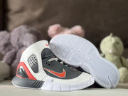 Pair of sneakers displayed with one shoe angled to show the white molded outsole traction pattern.