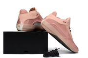 Rust pink Jordan 40 shoes posed with a black box.
