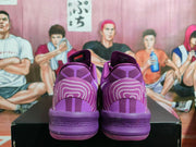 Rear view of purple Nike basketball sneakers showing layered heel panels, line graphics and perforated-looking midsole details.