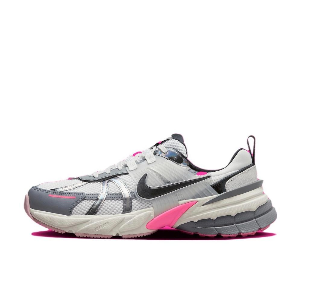 Side view of a chunky white, gray, and pink Nike sneaker with a Swoosh and layered panels.