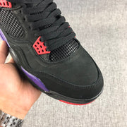 Close-up of the black laces, mesh toe panel, and red lace eyelet.