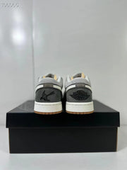 Rear view of the pair showing contrasting heel panels and Jordan branding details.