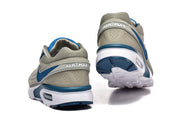 Rear view of gray Nike Air Max sneakers showing the heel details and outsole.
