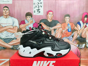 Side view showing the black upper, layered Nike Swoosh branding, white midsole, and red outsole details.