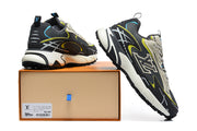 Pair of sneakers displayed on and beside a box, showing the heel and side details.