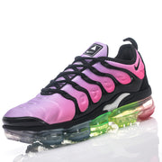 Angled front view of pink and lavender Nike TN-21 sneaker with black laces and multicolor sole