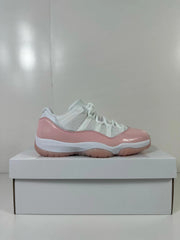 Side profile highlighting the glossy pink overlays, white mesh panels, and low-top shape.