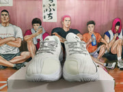 Front view of white basketball shoes with black-and-white patterned laces.