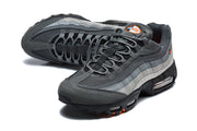 Pair of grey Nike Air Max 95 TT sneakers shown from above at an angled view