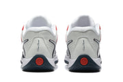 Rear view showing perforated heel panels, dark heel details, and red circular outsole accents.