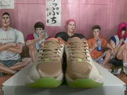 Front view of the Jordan sneakers showing tonal laces, brown toe panels, light neutral uppers, and translucent green outsoles.