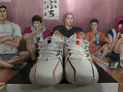 Front view of the white mismatched Nike basketball sneakers with contrasting black and red lace-area details.