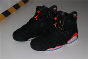 Pair of black and infrared high-top sneakers shown from an angled top view.