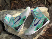 Angled view of the shoes displaying their side panels and outsoles