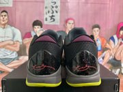 Rear view showing the black textured heels, burgundy collar details, graphic heel panels, and lime green outsole edges.