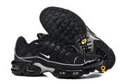 Black Nike Air Max Plus sneakers shown from the side and outsole, with patterned tread.