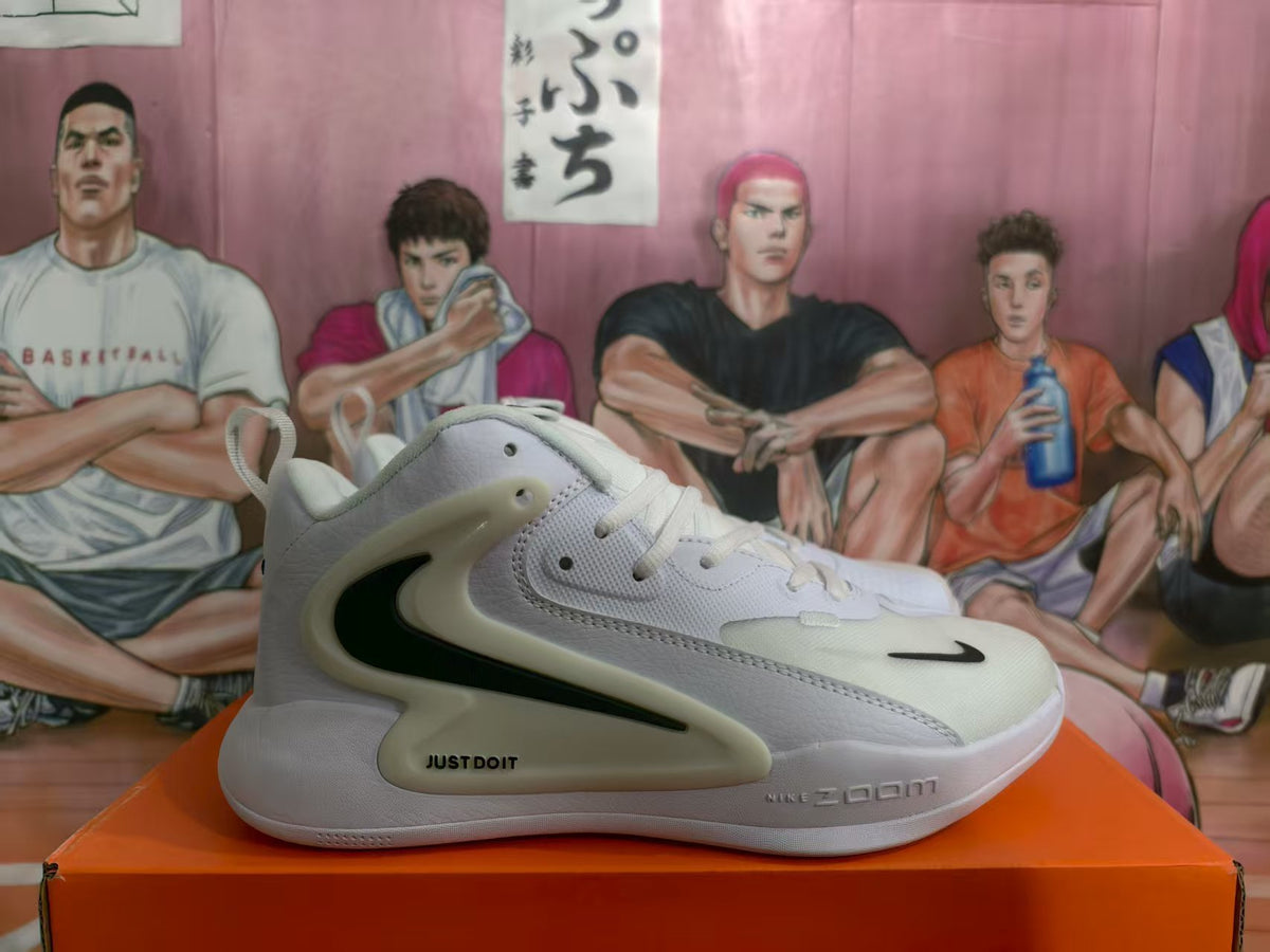 Side view of white Nike Zoom basketball sneakers with black Swoosh details and a sculpted midsole.