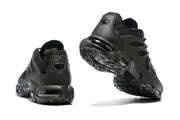 Rear and outsole views of black Nike Air Max Plus TN-style sneakers.