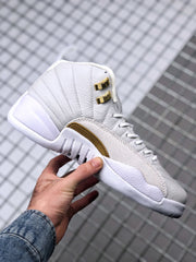 Side profile of the white high-top sneaker with stitched upper panels and gold-tone side branding.