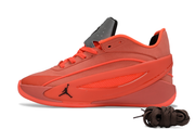 Bright red single sneaker shown in side profile with a contrasting side panel and dark laces.