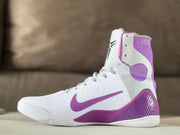 Opposite side view showing the white upper, purple Swoosh, and high collar.