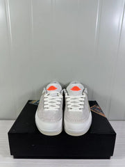 Front view of the pair showing tonal laces, perforated toe panels, and orange tongue logos.