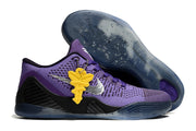 Purple shoe with a dark outsole and yellow hanging accent.