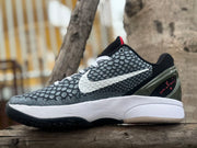 Opposite side view showing the patterned upper, white Swoosh, and heel detail
