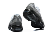 Rear and outsole views of grey Nike Air Max 95 TT sneakers