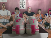 Rear view of the grey and pink basketball sneakers showing contrasting heel graphics, pink heel panels and speckled midsoles.