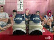Rear view of white and navy PUMA Rider Elite sneakers