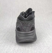 Rear view showing the padded heel collar and sculpted dark midsole.