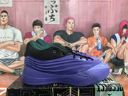 Side profile of a black and blue adidas basketball sneaker showing layered textured panels and green toe detailing.